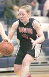 ROBERT DeBERRY/Frontiersman Houston Hawk Emily Hundley reaches
for the steal during Thursday's game against the Palmer Moose at
the Elks Shootout Basketball Tournament in Palmer