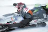 Chris Schachle hangs over the side of his snowmachine during a
recent Mat-Su Vintage Snowmachine Racing Club race. Photo Courtesy Patti Balzarini/freestylefoto