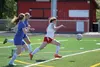Houston's Megan Adair splits a pair of Palmer defenders during a 3-2 loss to the Moose May 13, 2016 at Houston High School. JEREMIAH BARTZ/Frontiersman