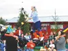 Mary Evanoff juggles fire while balancing on the Evanoff pole on
Sunday night. Photo by CASEY RESSLER/Frontiersman.