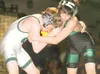 ROBERT DeBERRY/Frontiersman Colony Knights Charles Coisman and
Issac Wilson fight it out in the 103 lb. weight class during the
championship match of the Northern Lights Championship Tourname