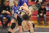 Wasilla's Samuel Wolff gets tied up with Palmer's Wyatt McGann during a 138-pound match of the semifinal round of the Northern Lights Conference Championships Dec. 12 at Wasilla High School. 