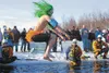 Isaiah Tira takes the plunge into Wasilla Lake during the 2012 Mat-Su Polar Plunge. ROBERT DeBERRY/Frontiersman.com