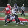 Lathrop senior Jamari Whiteside pulls down Wasilla senior running back Zachary Garnett during a 21-10 win over the Warriors Aug. 29 at Veterans Memorial Field in Wasilla. Jeremiah Bartz