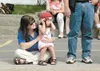 Randi Bunson-Riffle, 3, holds her ears as sirens and horns blow
Saturday’s as Wasilla’s Fourth of July parade wends through the
downtown area. ROBERT DeBERRY/Frontiersman