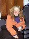 Lynda Plettner relaxes in the Iditarod headquarters in Nome
shortly after her finish.TIM BRODT/Frontiersman