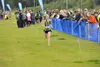 Colony freshman Jill Bowker races down the final stretch during the Tsalteshi Invitational in Soldotna Aug. 23. Bowker finished third in the girls race. Jeff Heliminiak/Peninsula Clario