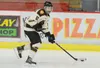 Kenai River Brown Bears Tanner Schachle gets control of the puck and sprints down the rink Oct. 24 at the Soldotna Regional Sports Complex in Soldotna. Photo by Kelly Sullivan/ Peninsu