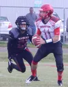 Eielson linebacker Jiro Dobashi-Noa pressures Houston quarterback Terry Horseman during the second quarter of Saturday’s Aurora Conference high school football game at Buck Nystrom Field on E