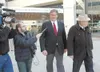 DENNIS ZAKI/Courtesy photo Former state Rep. Vic Kohring,
center, is approached by media walking into court Tuesday in
Anchorage. He'€™s accompanied by attorney Wayne Ross, far
right.