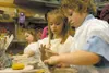 Girl Scout members Morgan Goudey, Kaila Stoker and Savanna
Ginochio of Troop #958 are making "Bowls for Beans," a volunteer
effort for sales of the bowls to benefit Beans Café and the Wasilla
