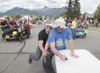 Midas bed racer Ryan Johnston gets shouldered out at the finish
line by Integrated logic's Matt Day during Friday's preliminary bed
races. This race knocked Midas out of the competition and a