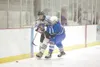 Palmer defenseman Andrew Ferguson battles with Chugiak Mustang
Ben Matthews during Saturday’s game for third place at the Curtis
C. Menard II Memorial Ice Arena in Wasilla. (ROBERT
DeBERRY/Fr