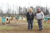 Musher Mary Helwig, left, and filmmaker Jennifer Hawks pose for a photo in the dog yard behind Helwig's Willow home on Oct. 3, about a year and a half since the Sockeye fire consumed her home