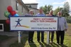 Executives from the Pacific Northwest Adult and Teen Challenge smile for a photo oustide the new Alaska campus at a grand opening barbecue on Friday, June 3. From left to right: Pacific North