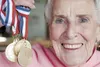 Jane Soeten holds four gold medals she won in the Alaska International Senior Games in Fairbanks recently. Soeten won the discus, javelin, shot put and racquetball competitions. She has compe