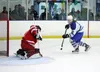 Palmer's Nathan Hooks throws a shot toward Wasilla goalie Bryce Frazier during Wasilla's 5-2 win over Palmer Thursday, the first day of the Palmer Hockey Showdown. Tim Rockey/Frontiersman