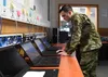 Airman 1st Class Wesley Carrow, 52nd Communications Squadron client systems technician, performs routine maintenance on computer systems connected to the Air Force network April 6. In June, t
