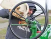 Allen Morgan, Willow, tops off his vintage 1940 Model 'H' John Deere tractor before the beginning of the 'Take Your Tractor to Work' parade from the Alaska State Fairgrounds to downtown Palme