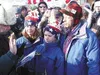 At the finish line in Nome, Martin Buser takes the oath to
become a U.S. citizen as his family watches.TIM
BRODT/Frontiersman