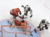 Colony's Colton Symbol and Curtis Foster put pressure on Wasilla goalie Wyatt Monear and defenseman Tyler Hansen during Thursday's game at the Curtis C. Menard II Memorial Ice Arena in Wasill