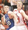 ROBERT DeBERRY/Frontiersman Wasilla’s Zach Orr and Palmer’s Nate
Svedin fight for position during Friday’s game at Wasilla High.