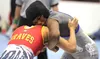 Palmer's Teeana Nicholai maintains a grip of Mt. Edgecumbe's Andrea Prince during the 132-pound girls final of the Lancer Smith Memorial Saturday at the Menard Sports Center in Wasilla. Jerem