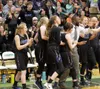 Palmer head coach Elgin Hollins and the Moose celebrate a 57-52 win over Colony Friday night at Colony High. The win marked Palmer's first victory over Colony since 2014. Courtesy of Bruce Eg