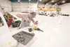 ROBERT DeBERRY/Frontiersman John Pekkala prepares the fuselage
roof for a new GPS antenna on an aircraft at the Hageland Aviation
maintenance hangar in Palmer.