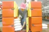 ROBERT DeBERRY/Frontiersman file photo Joan Treiber loads the
cold portions of meals for delivery into a cooler at the Wasilla
Senior Center. The center has raised the fees for assisted care
