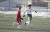 Colony senior Isaiah Hall works the ball down the field during a win over East Anchorage March 23, 2017, at Colony High School. After clearing the field to host that match, the Knights had to