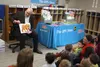 The UPS Store President Tim Davis reads to CCS Early Learning students after donating over 8,000 books to the program on Thursday, April 18. Jacob Mann/Frontiersman