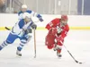 ROBERT DeBERRY/Frontiersman Palmer Moose Nick Reeves moves on
Wasilla Warrior Levi Johnston during the third period of Friday's
game at the Palmer Ice Rink. The Warriors defeated the Moose
6-