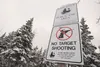 A ‘no target shooting’ sign shows the evidence of target practice near the Knik River Public Use Area trailhead. ROBERT DeBERRY/Frontiersman.com