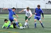 Colony sophomore Noah Krozel weaves his way through a pair of defenders and Kodiak's diving goalkeeper during Colony's 8-0 win over the Bears in the Northern Lights Conference boys' quarterfi