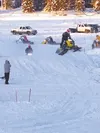 Riders enjoy a perfect day of snow-cross racing at Big Lake Saturday. CHRIS FORD/Frontiersman