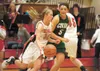 Wasilla's Alyssa Hutchins moves past Colony's Mary Klapperich during Friday's game at Wasilla High School. Robert DeBerry