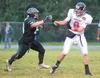 ROBERT DEBERRY/Frontiersman Colony senior Trey Farber, right,
chases down Juneau-Douglas quarterback Phillip Fenumiai.