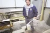 ROBERT DeBERRY/Frontiersman Palmer utilities manager John
Berberich holds a container of treated water Monday at the Palmer
wastewater treatment facility. The water is run through a
high-inte