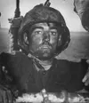 A U.S. Marine, Pvt. Theodore J. Miller, exhibits a "thousand-yard stare": an unfocused, despondent and weary gaze which is a frequent manifestation of "combat fatigue," which is now referred 