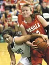 Colony's Sarah Brumbaugh tries to rip the ball away from Wasilla's Shayla Johnson during the second half of a 52-47 overtime win over Wasilla Tuesday at Wasilla High. BRUCE EGGLESTON/matsuspo