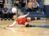 Wasilla Warrior Courtney Lowe dives for a ball during Thursday’s volleyball match against the Palmer Moose. ROBERT DeBERRY/Frontiersman