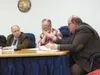 Rep. Norm Rokeberg, R-Anchorage, front, discusses points of an
issue raised at a recent hearing of the House Special Committee on
Ways and Means while Rep. Carl Moses, D-Anchorage, looks on. 