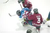 ROBERT DeBERRY/Frontiersman Alaska Avalanche Kyle Pichler is
squeezed between two Fairbanks Ice Dogs during Friday’s game in
Wasilla.
