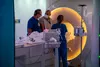 200812-N-LW757-1001 SAN DIEGO (Aug. 12, 2020) Staff assigned to Naval Medical Center San Diego's (NMCSD) Radiology department prepare a patient for a brain MRI Aug. 12. The coronavirus (COVID