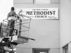 Courtesy photo Workers put the finishing touches on the sign at
the new location of Palmer United Methodist Church.