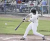 JEREMIAH BARTZ/Frontiersman Mat-Su outfielder Dominick Francia
turns on a pitch during a 5-2 in win over the Peninsula Oilers on
Tuesday. The Miners started a four-game series with the Anchor