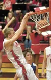 Wasilla senior Connor Devine slam dunks the ball during the final seconds of Friday’s win over the Kodiak Bears at Wasilla High School. ROBERT DeBERRY/Frontiersman