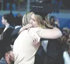 Delaney Burris hugs a loved one during the rose ceremony of the Mat-Su Central graduation. Jeremiah Bartz/Frontiersman