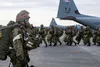 Japan Ground Self Defense Force paratroopers line up to load onto a C-130J Super Hercules, assigned to the 374th Airlift Wing, during exercise Airborne 21 at Yokota Air Base, Japan, March 9, 